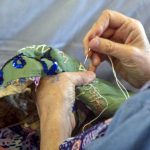 Hospice patients and volunteers contribute to Suffrage in Stitches